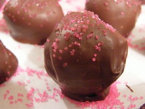 milk chocolate oreo truffles with pink candy sprinkles